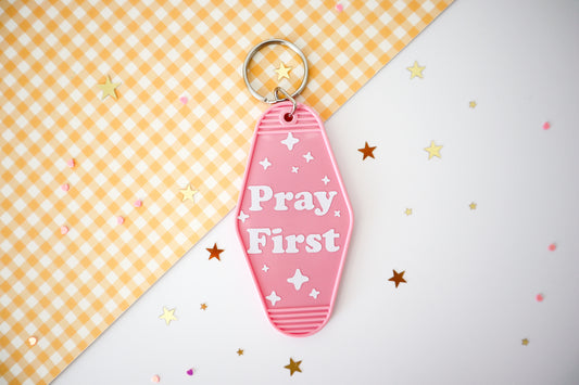 Pray First Hotel Keychain