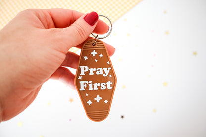 Pray First Hotel Keychain