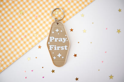 Pray First Hotel Keychain